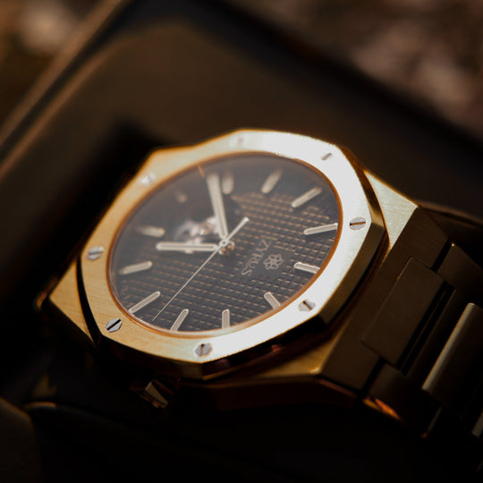 Zyrus Open Heart Watch in gold, captured at sunset, showcasing its timeless elegance and sophisticated design.