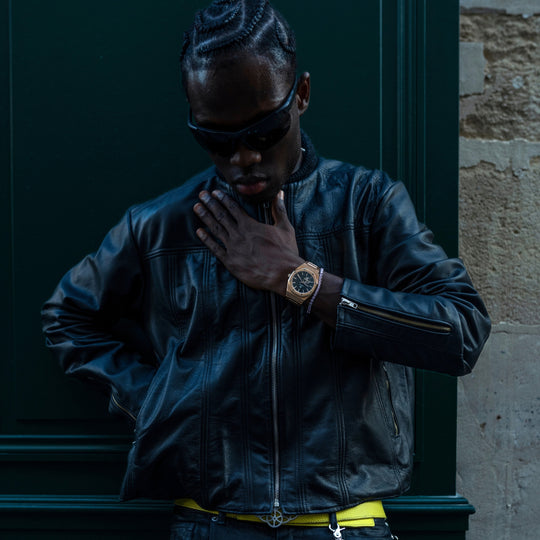 Man wearing a Zyrus Rose Gold Aperture watch in a lifestyle setting.